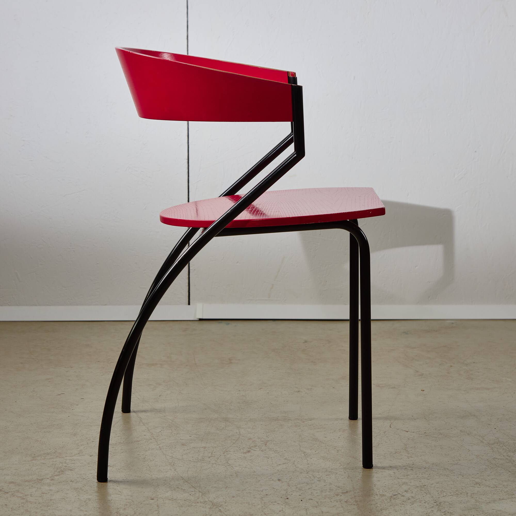 Red Plywood and Curved Metal Frame Chair