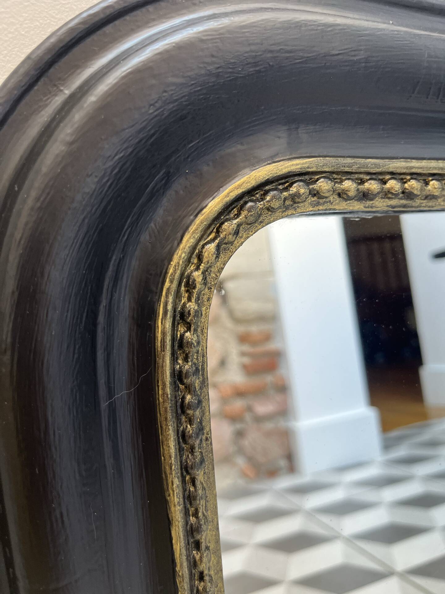 Louis Philippe mirror in black and gold