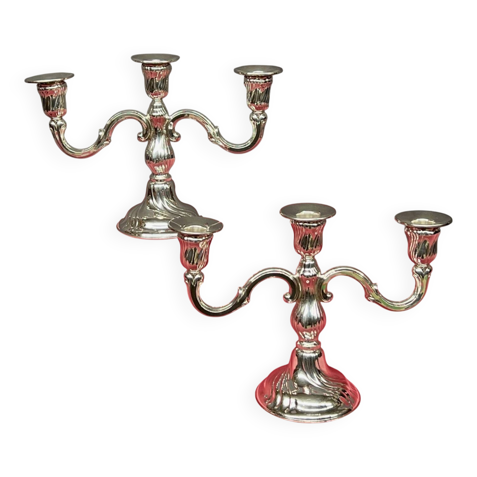 Pair of candlesticks. Silver-plated metal.