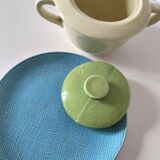 Two sugar bowls and a textured plate in turquoise and green Salins earthenware.