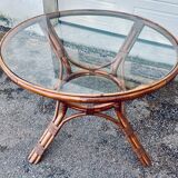 Round rattan and wicker table with glass top