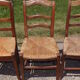 17 old straw chairs