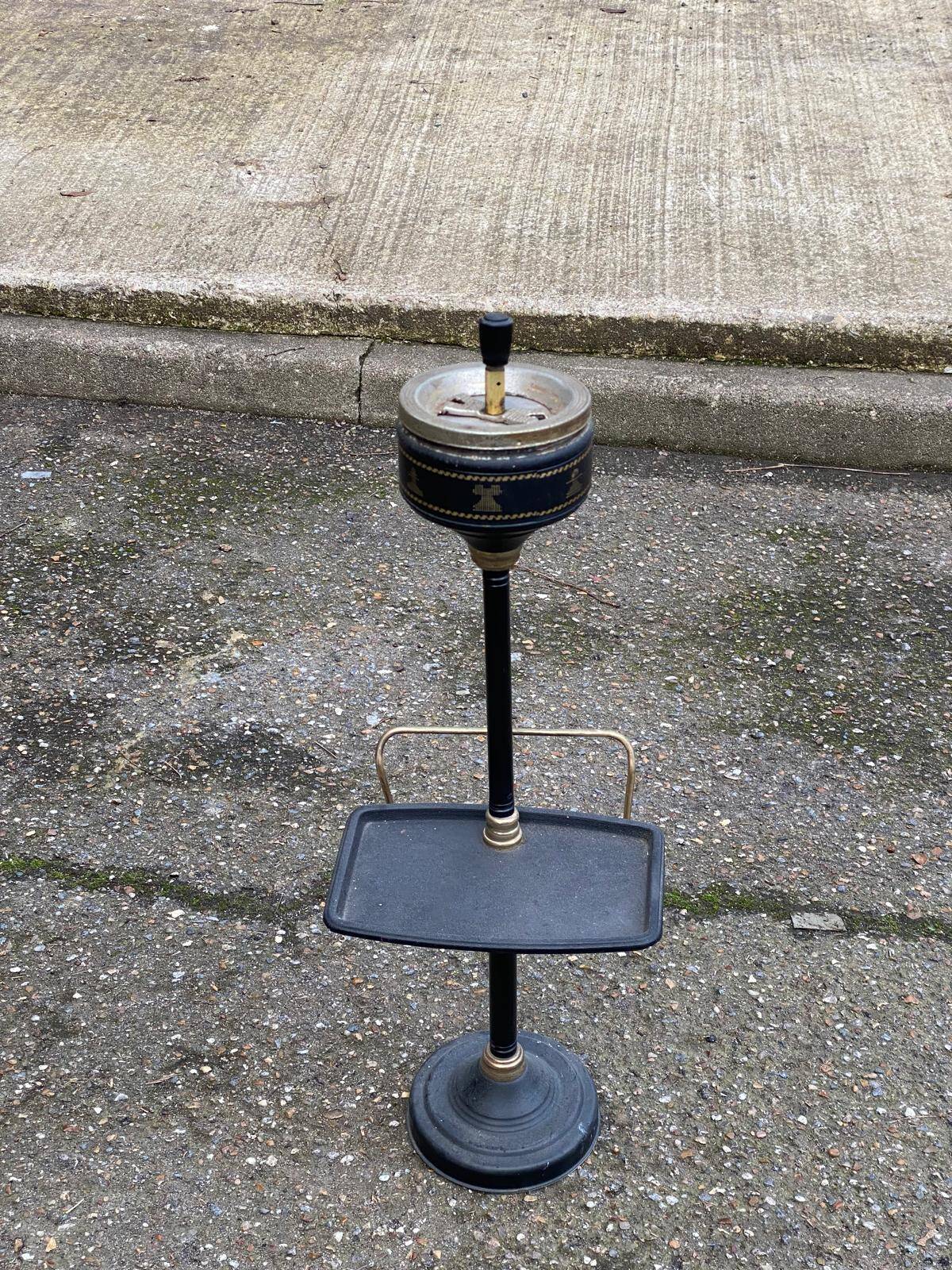 Vintage ashtray on a stand with a magazine holder from the 1960s.