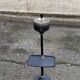Vintage ashtray on a stand with a magazine holder from the 1960s.