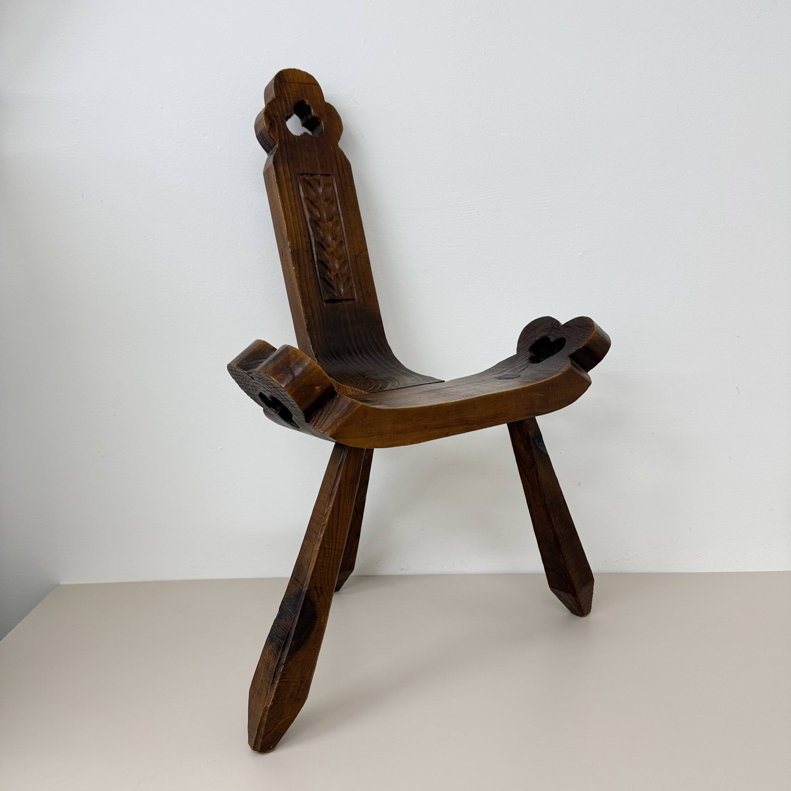 Brutalist hand carved oak Spanish tripod chair , 1970s