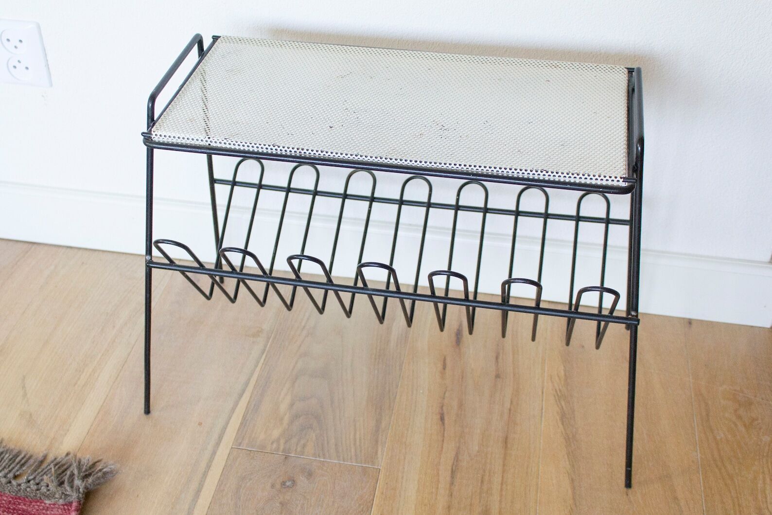 Mid century perorated metal side table with a magazine rack - pilastro tomado artimeta era
