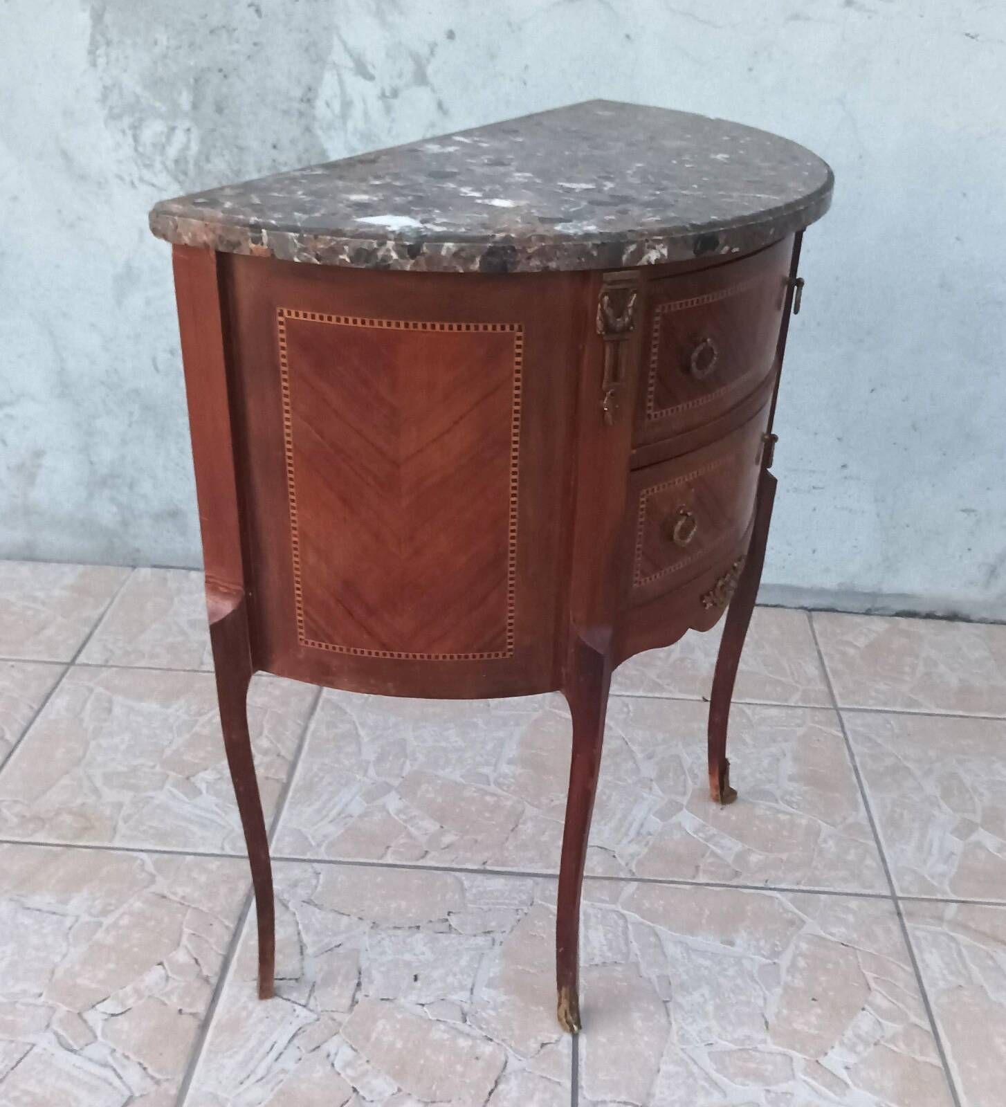 Half-moon commode in Louis XV style with walnut veneer.