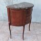 Half-moon commode in Louis XV style with walnut veneer.