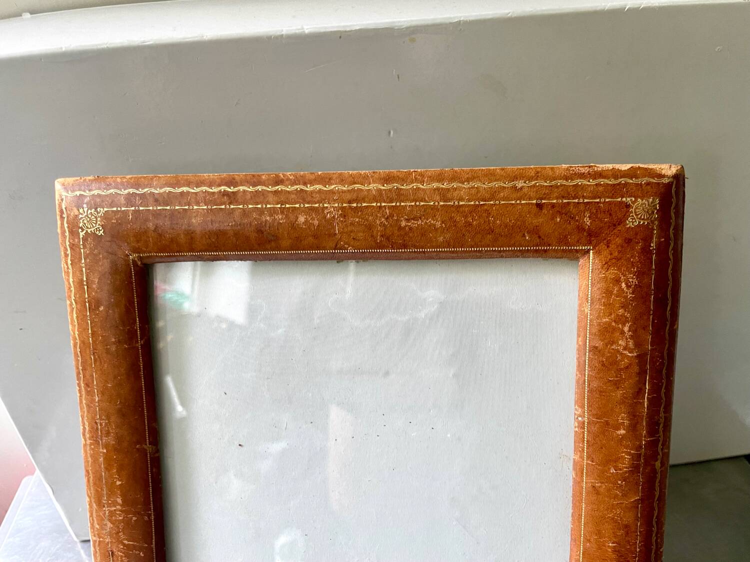 Antique  leather  with gilding frame measurements 31 cm x 25 cm