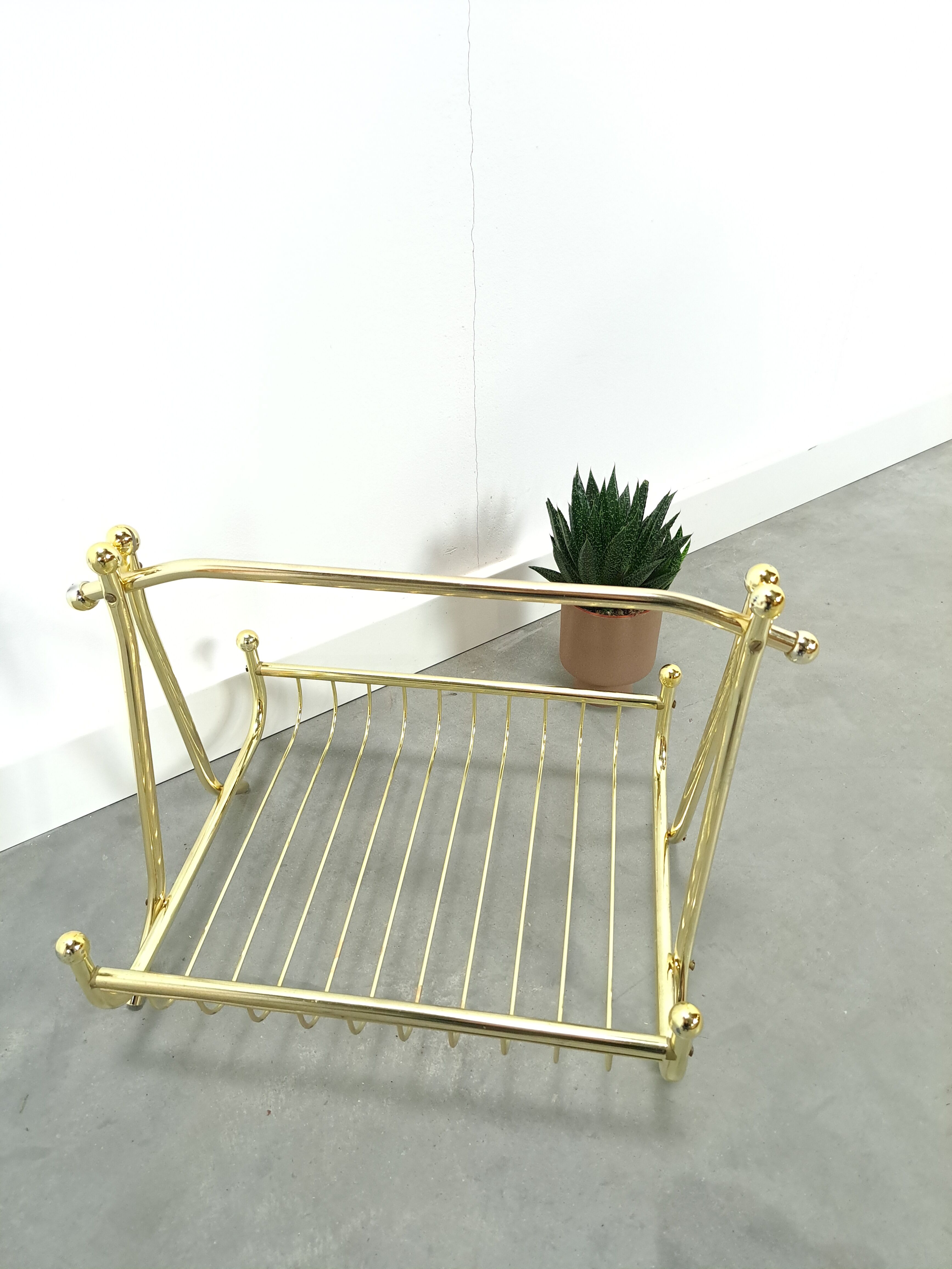 Gold magazine rack