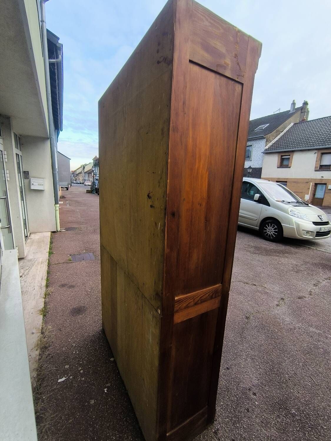 Vintage 1940s secretary desk with wooden curtains, storage, and shutters.
