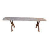 French country style cast iron bench with old rustic wooden plank