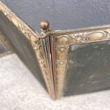 Antique fireplace screen in copper and brass from the 19th century.