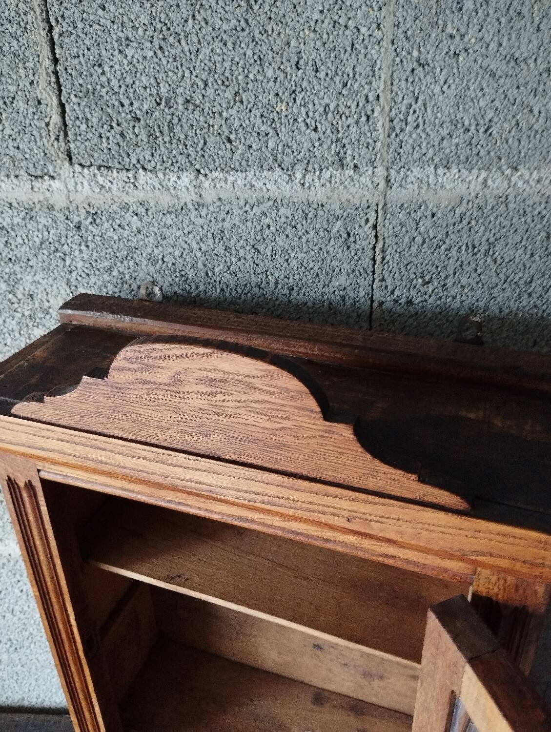 Old glass wall shelf with drawer door
