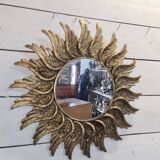 sun mirror with angel wings in golden patinated stucco