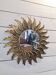 sun mirror with angel wings in golden patinated stucco