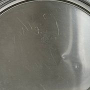 Large stainless steel serving platter with fish-shaped handles.