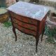 Antique marquetry commode with marble top in Louis XVI style.