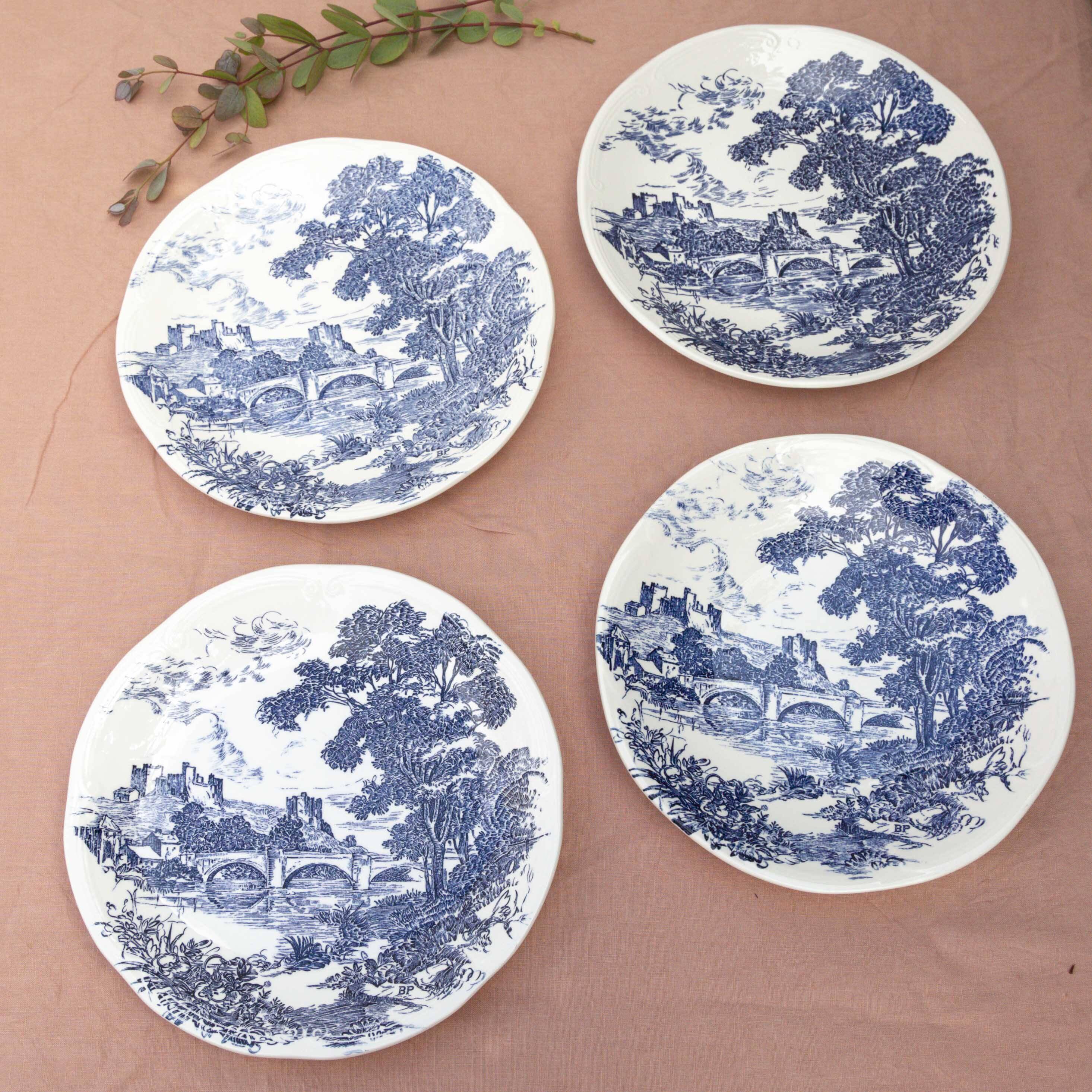 4 blue Gien plates with castle village bridge decor