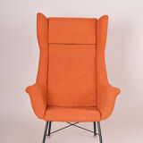 Orange Mid Century Modern armchair, made in 1960s Czechia
