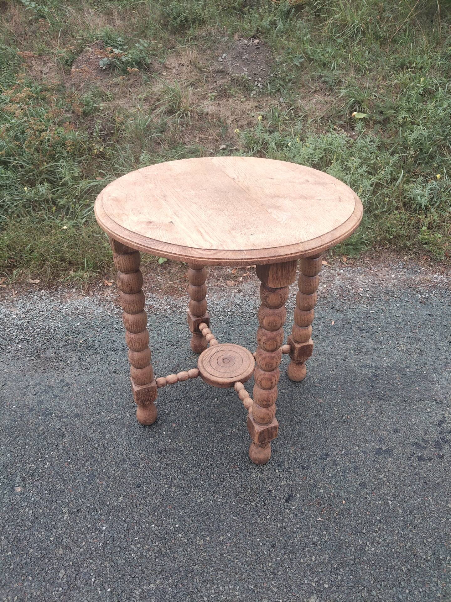 Oak gueridon in the style of Charles Dudouyt, 1940-50.