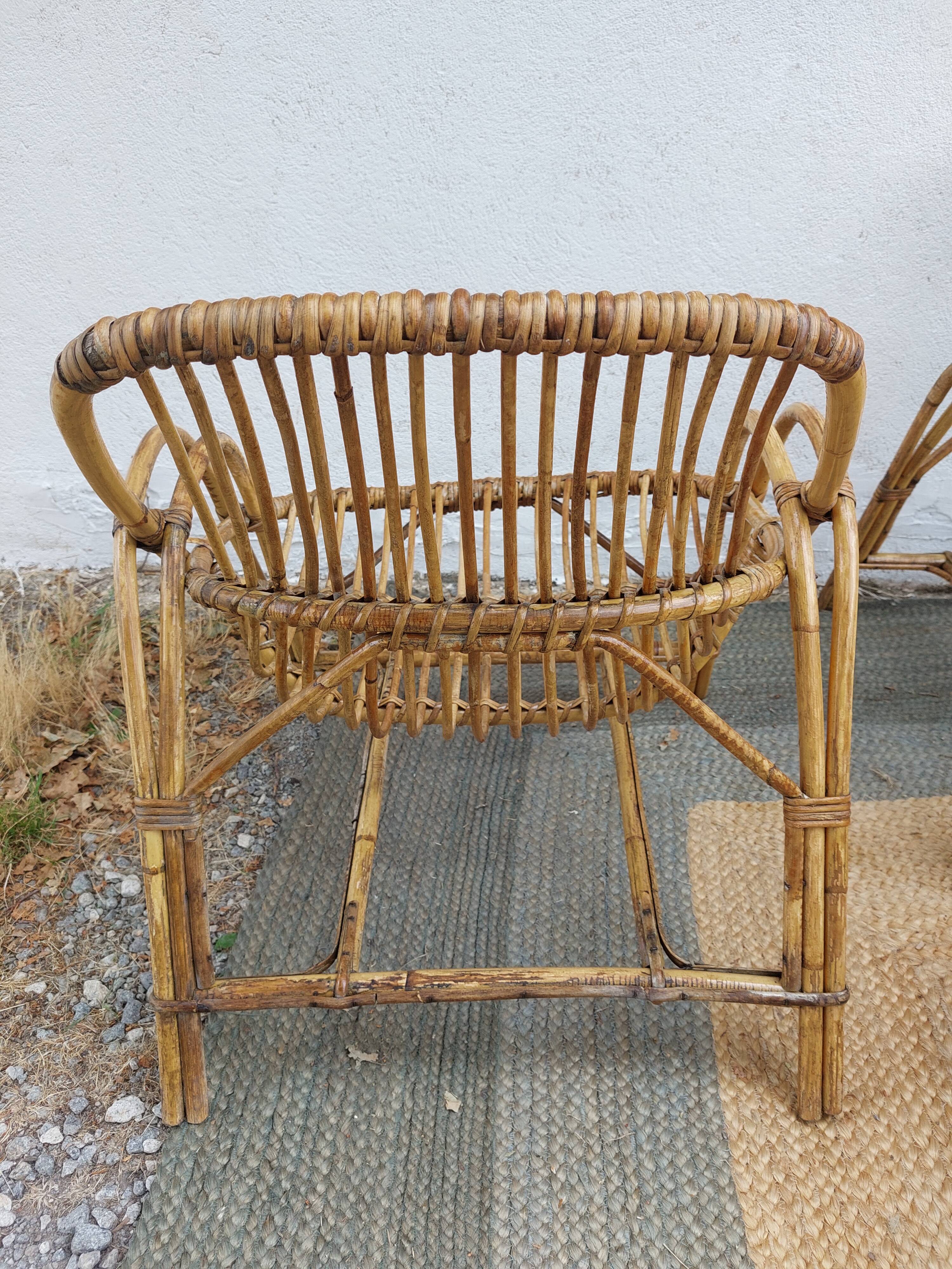 4 armchairs and a coffee table made of rattan and bamboo wood, vintage.