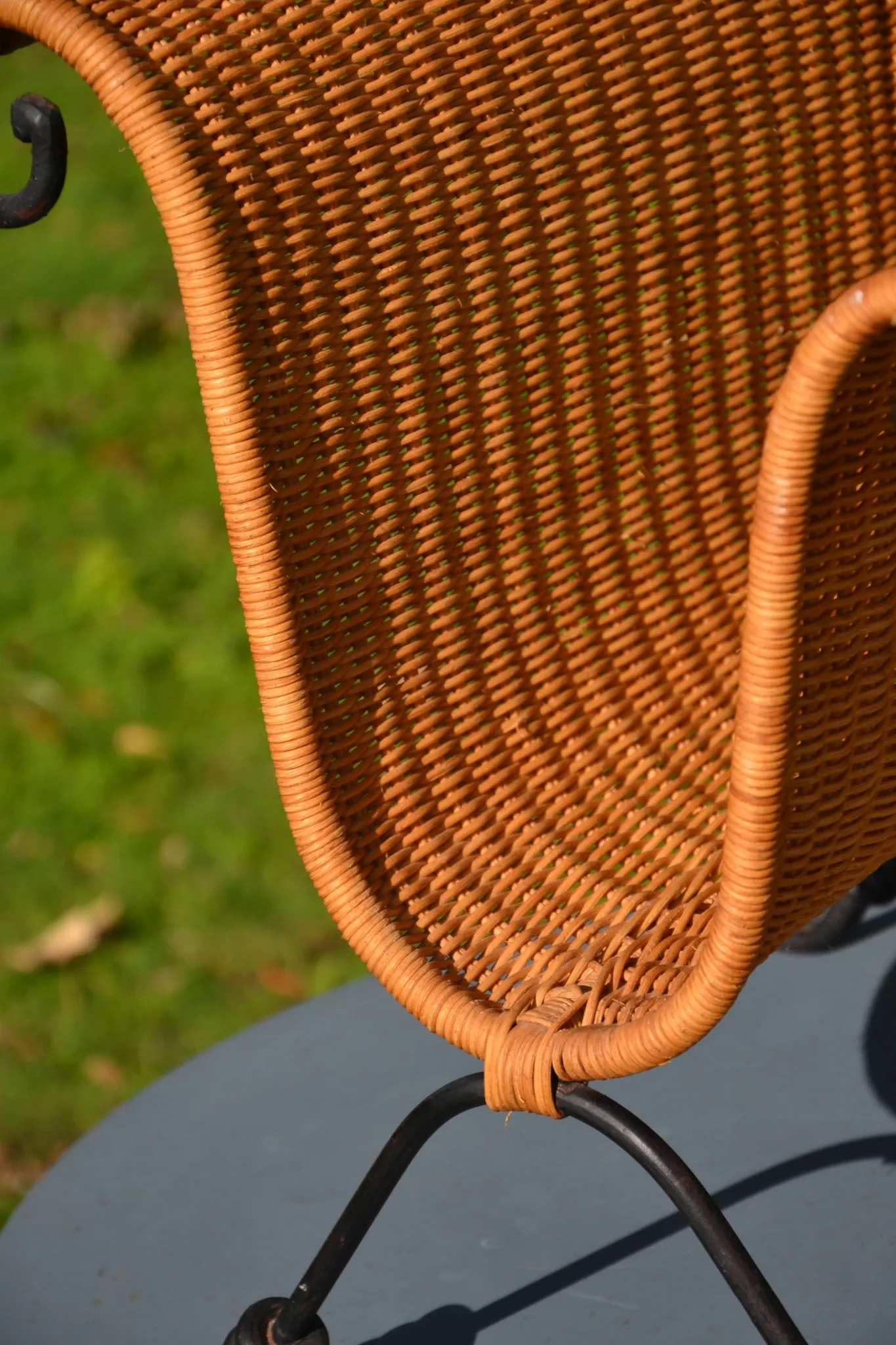 Wrought iron and rattan magazine/newspaper rack
