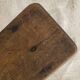 Old low stool made of solid wood