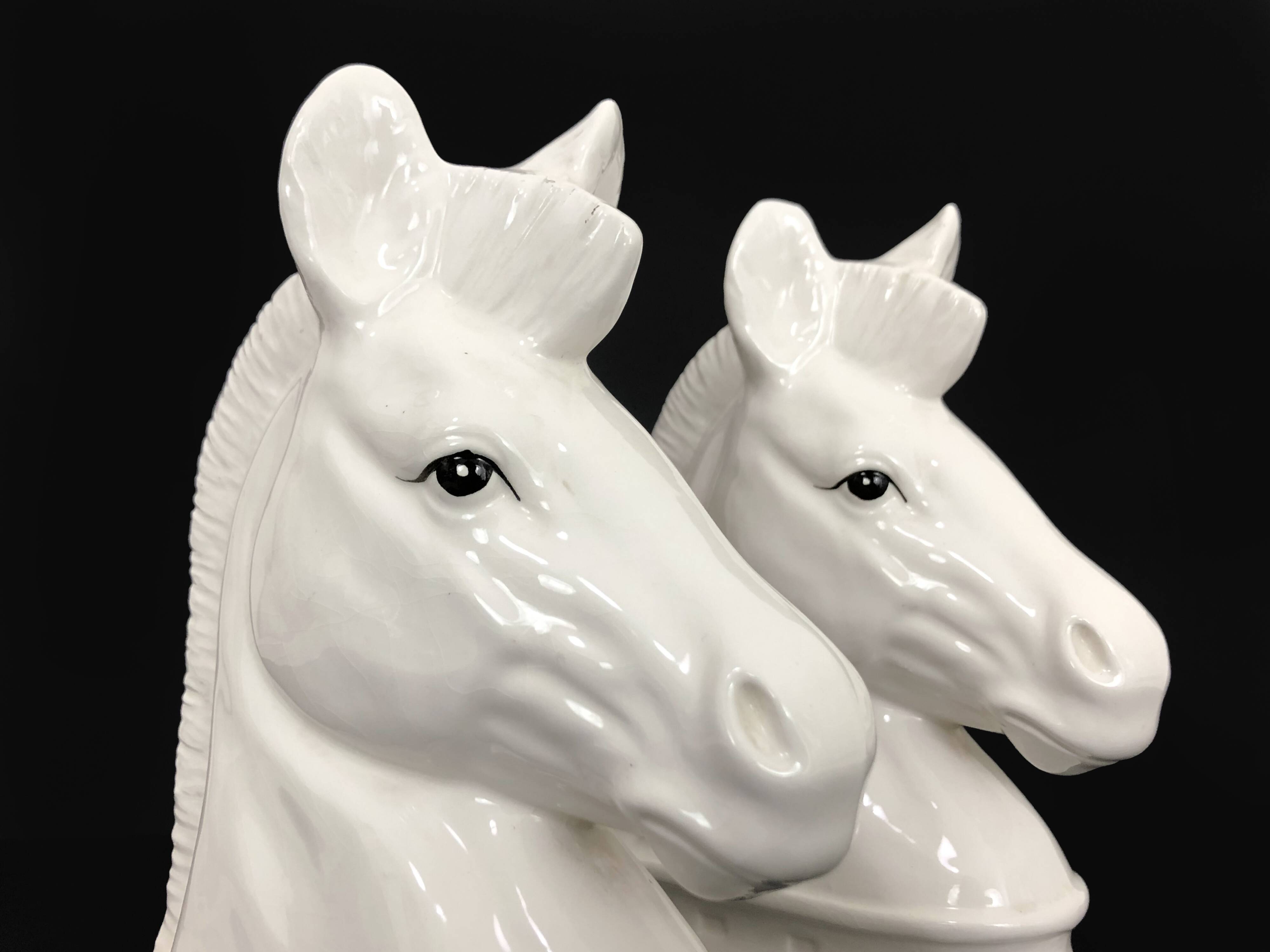 Pair of vintage white ceramic weighted horse bookends. 80 years