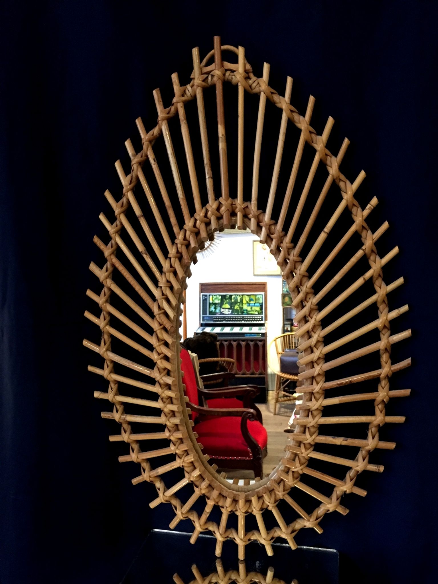 Oval shaped sun mirror in vintage rattan 1960/1970