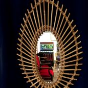 Oval shaped sun mirror in vintage rattan 1960/1970