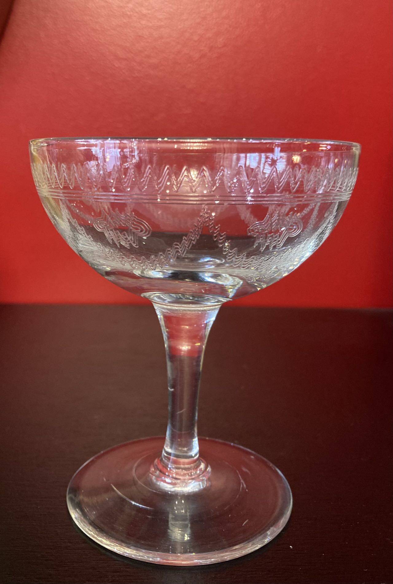 Early 20th century champagne glass burst by hand