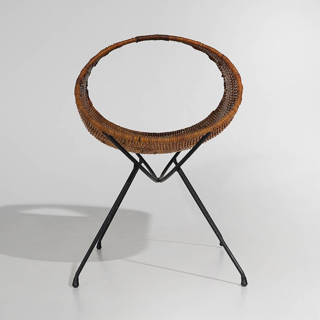 Rattan magazine rack with metal legs, 1950s