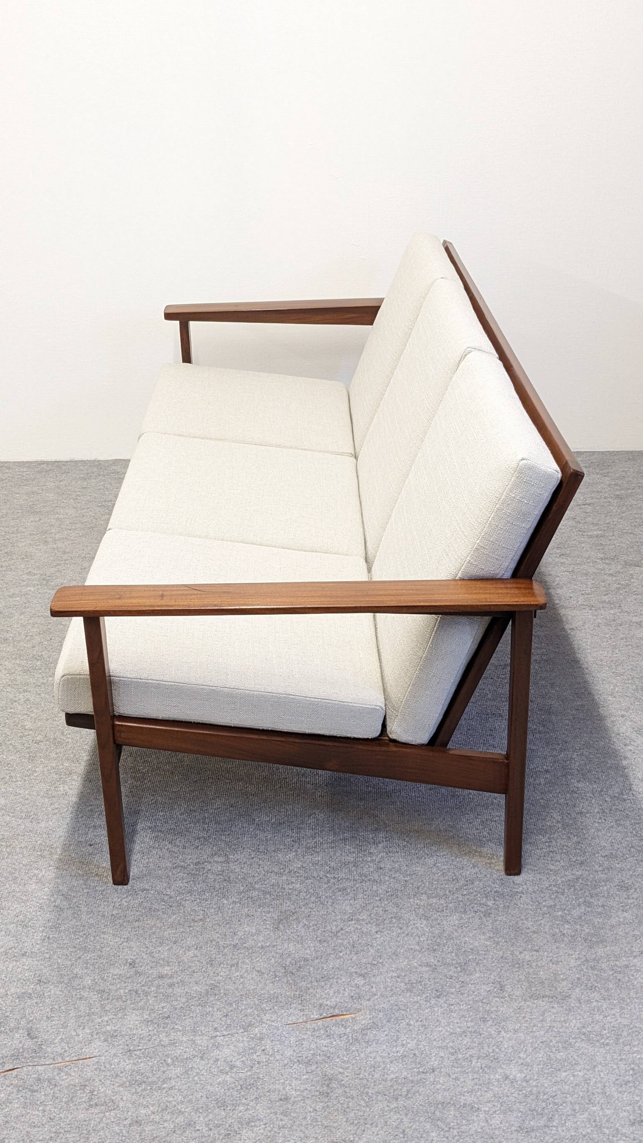 Scandinavian style three-seater sofa in teak, France circa 1950.