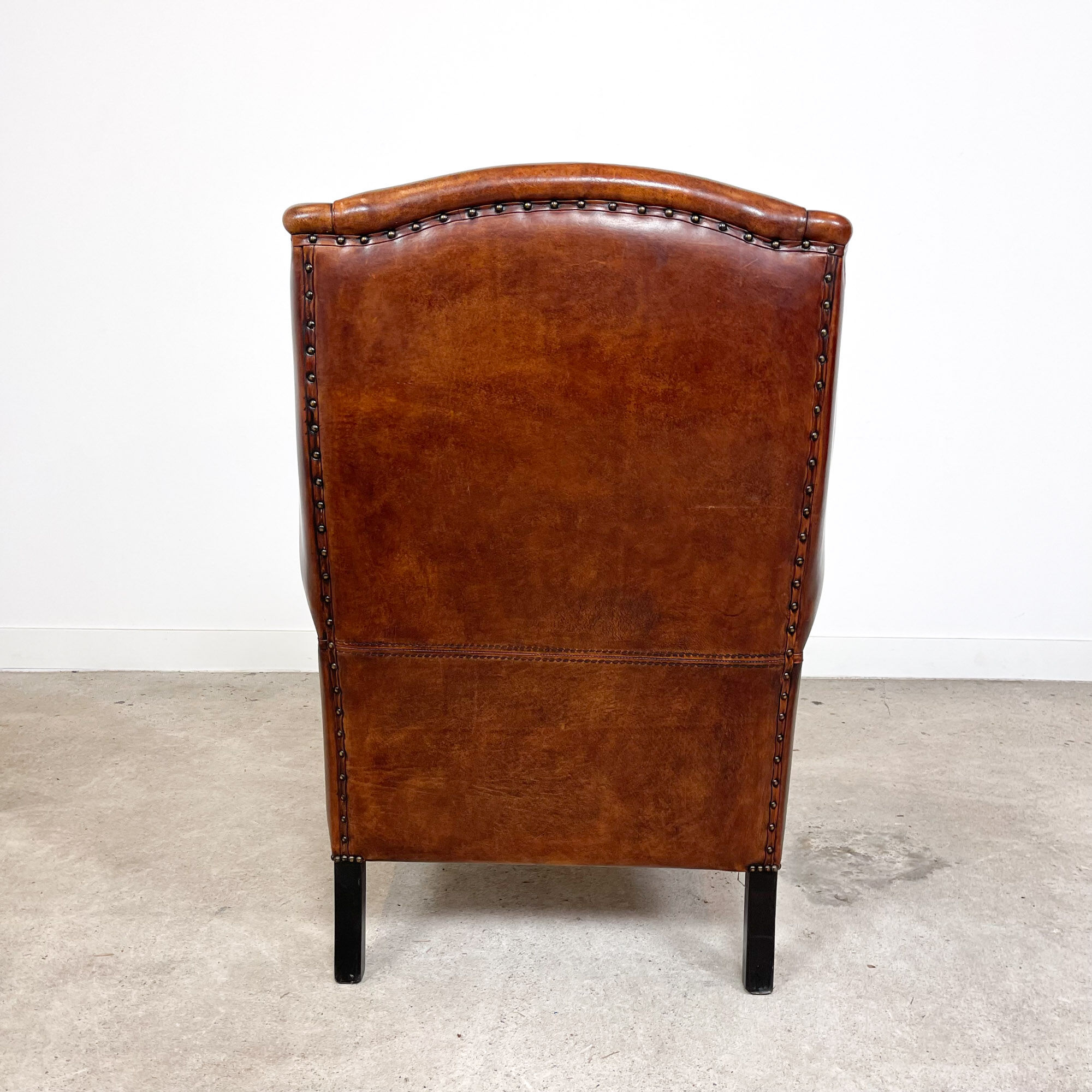 Vintage sheep leather wingback armchair by Lounge Atelier