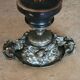 Patinated bronze cup, richly decorated with foliage and bunches of grapes