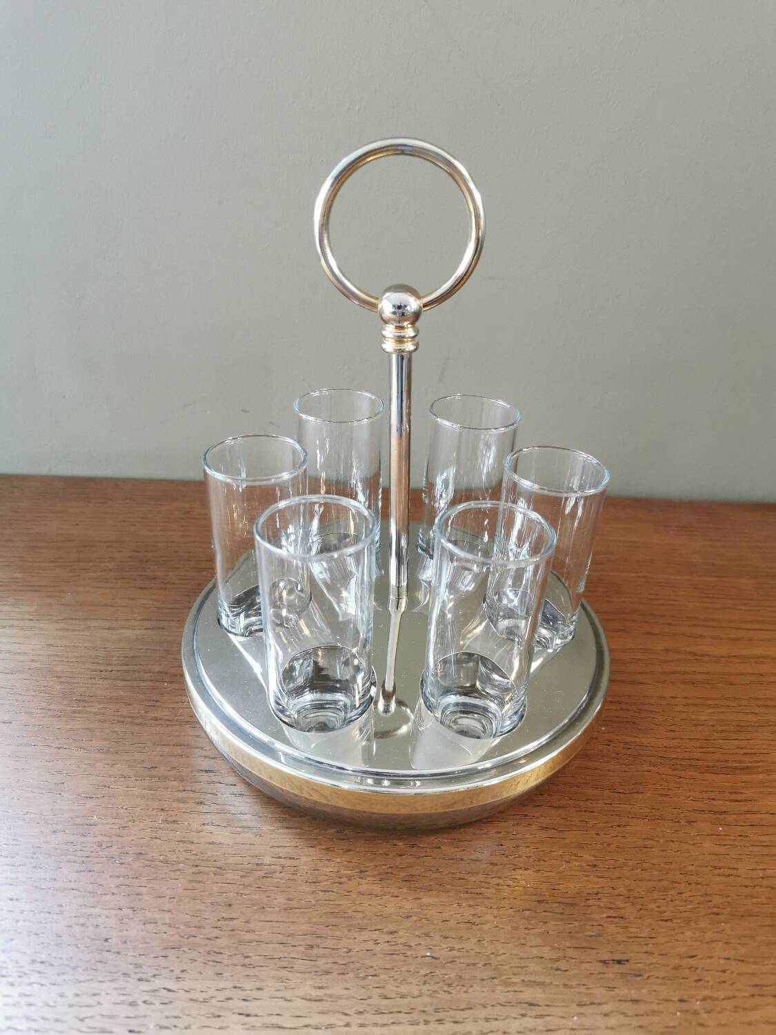 6 shot glasses on vintage metal support
