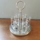 6 shot glasses on vintage metal support
