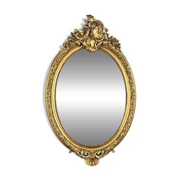 Oval gilded wooden mirror in Louis XV style, 19th century