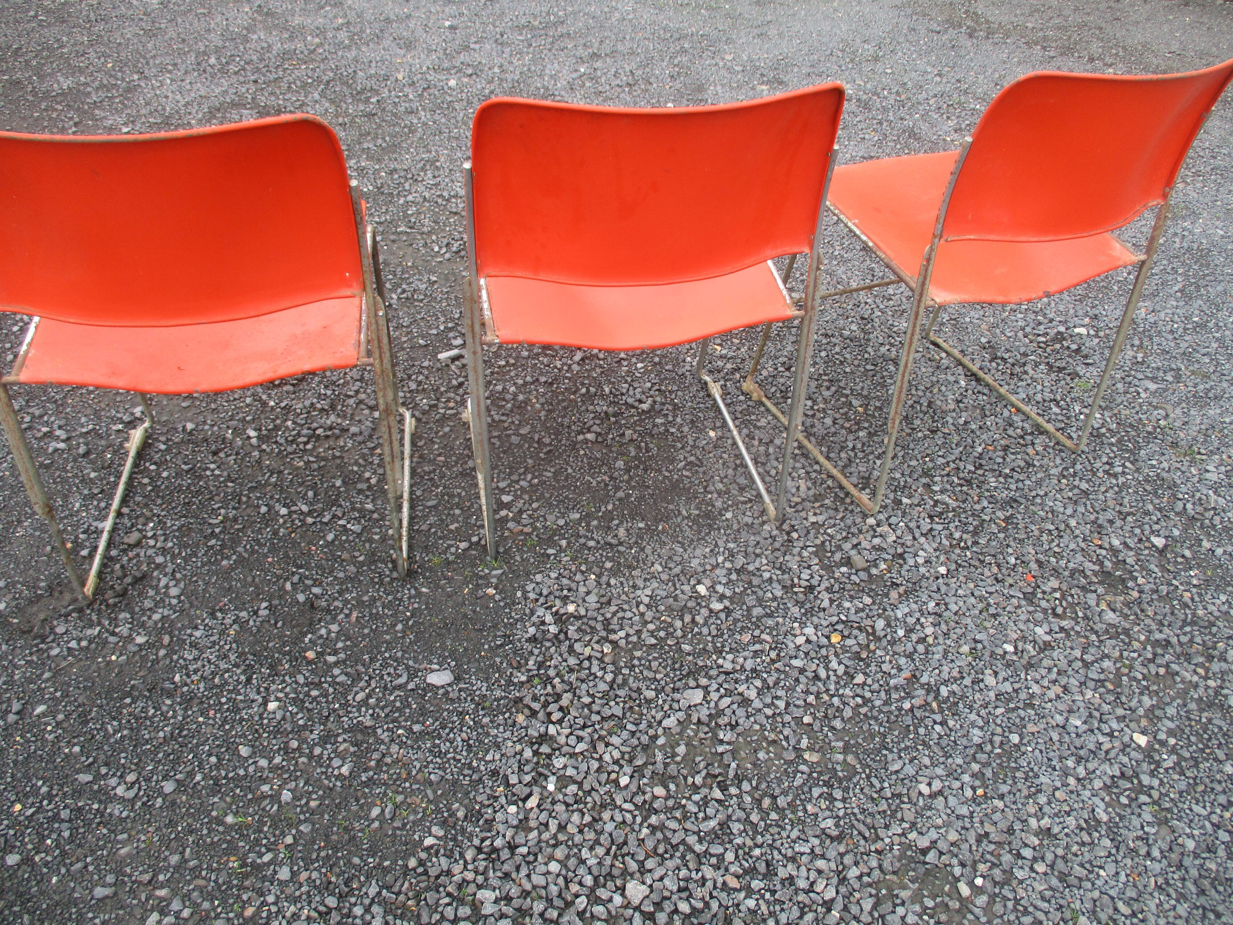 3 iron and plastic chairs