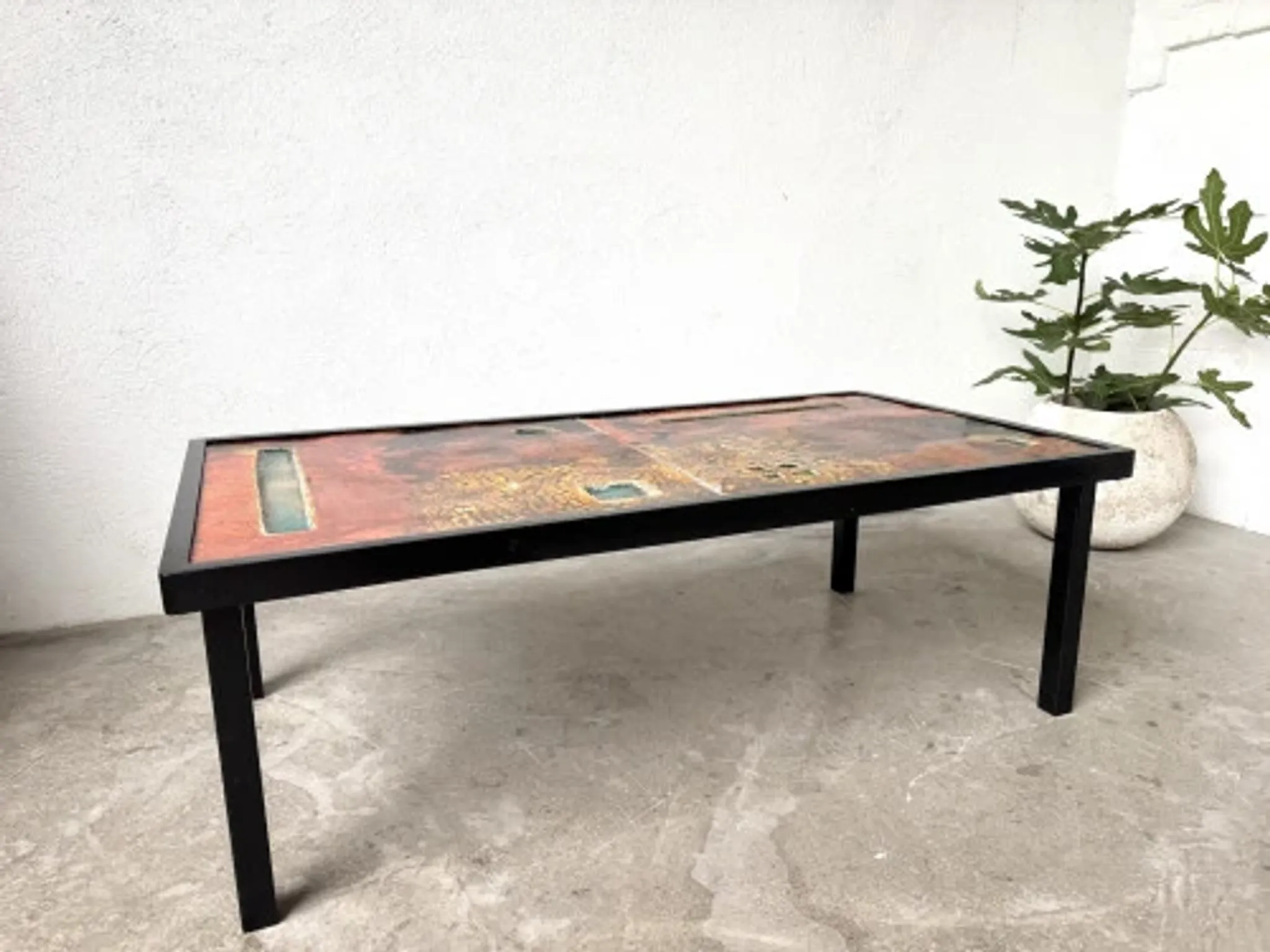 Coffee table by Robert and Jean Cloutier in enamelled lava and metal, 1950s.