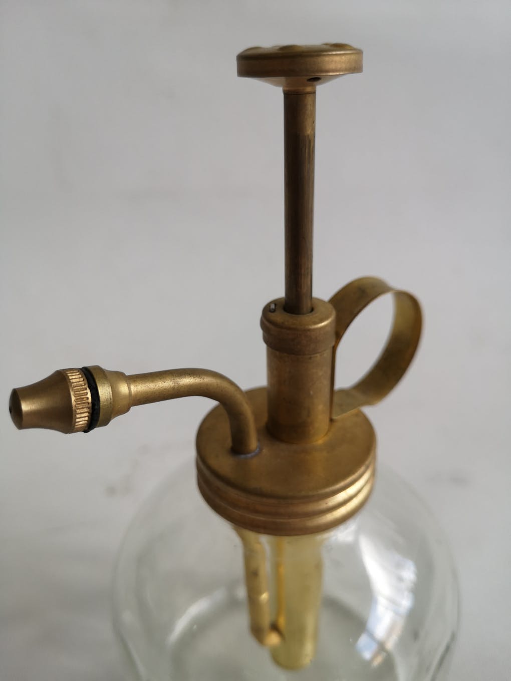 Transparent glass spray and gold metal