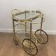Oval brass trolley from Maison Baguès.