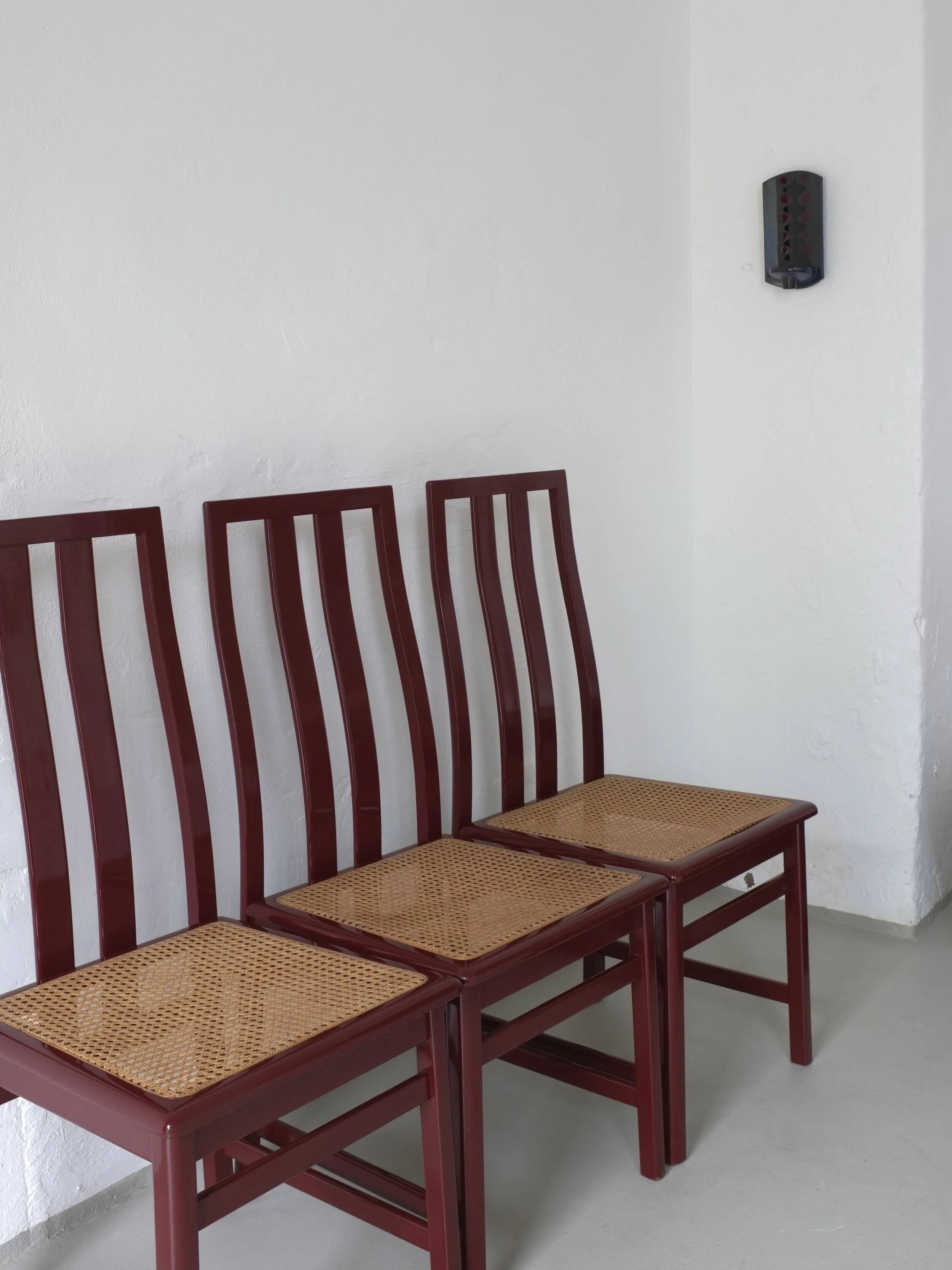 4 Glossy wine red cane seat chairs | Italy | 1970s