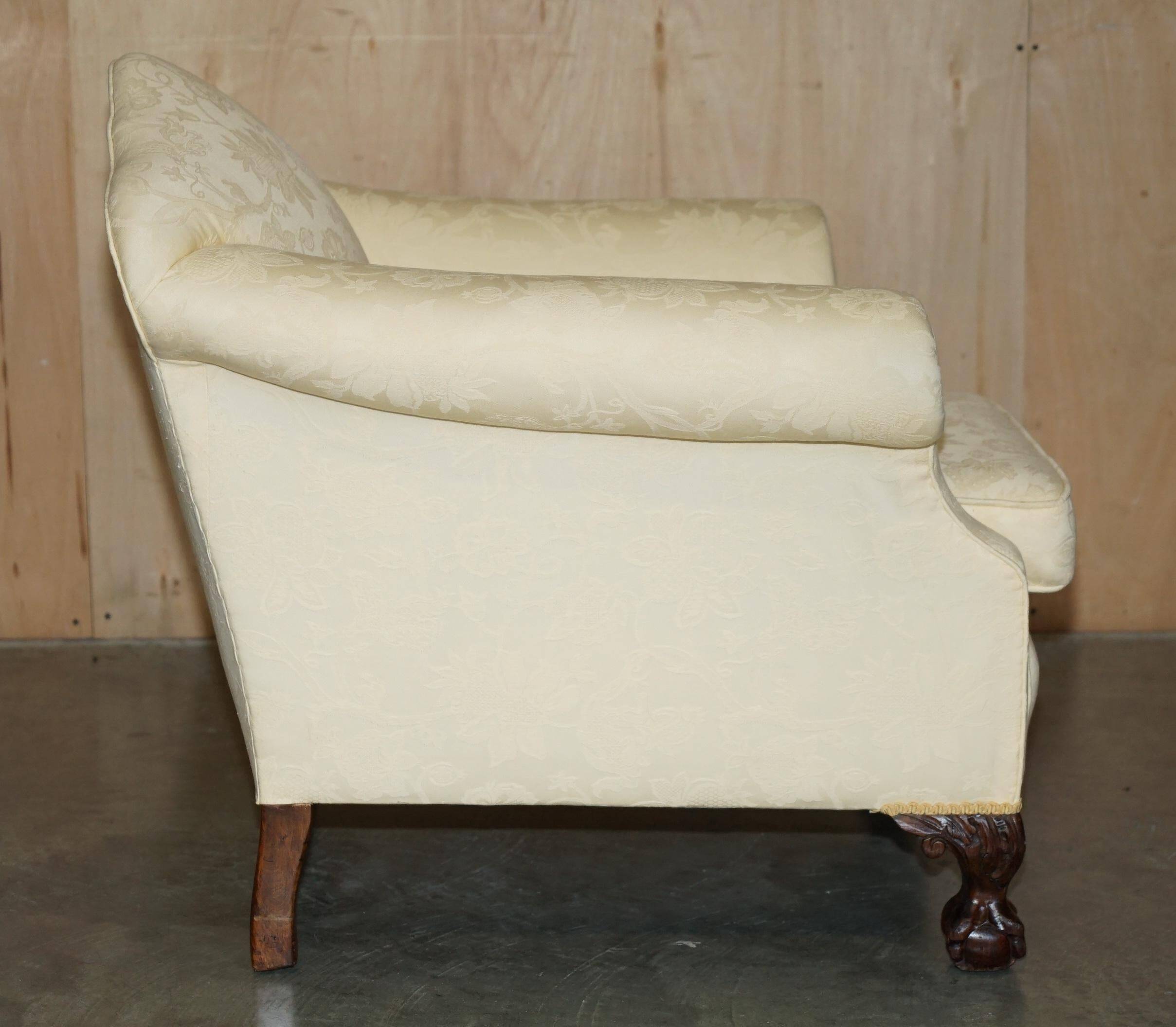 Pair of Edwardian armchairs from 1910 with carved legs and fabric.