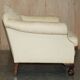 Pair of Edwardian armchairs from 1910 with carved legs and fabric.