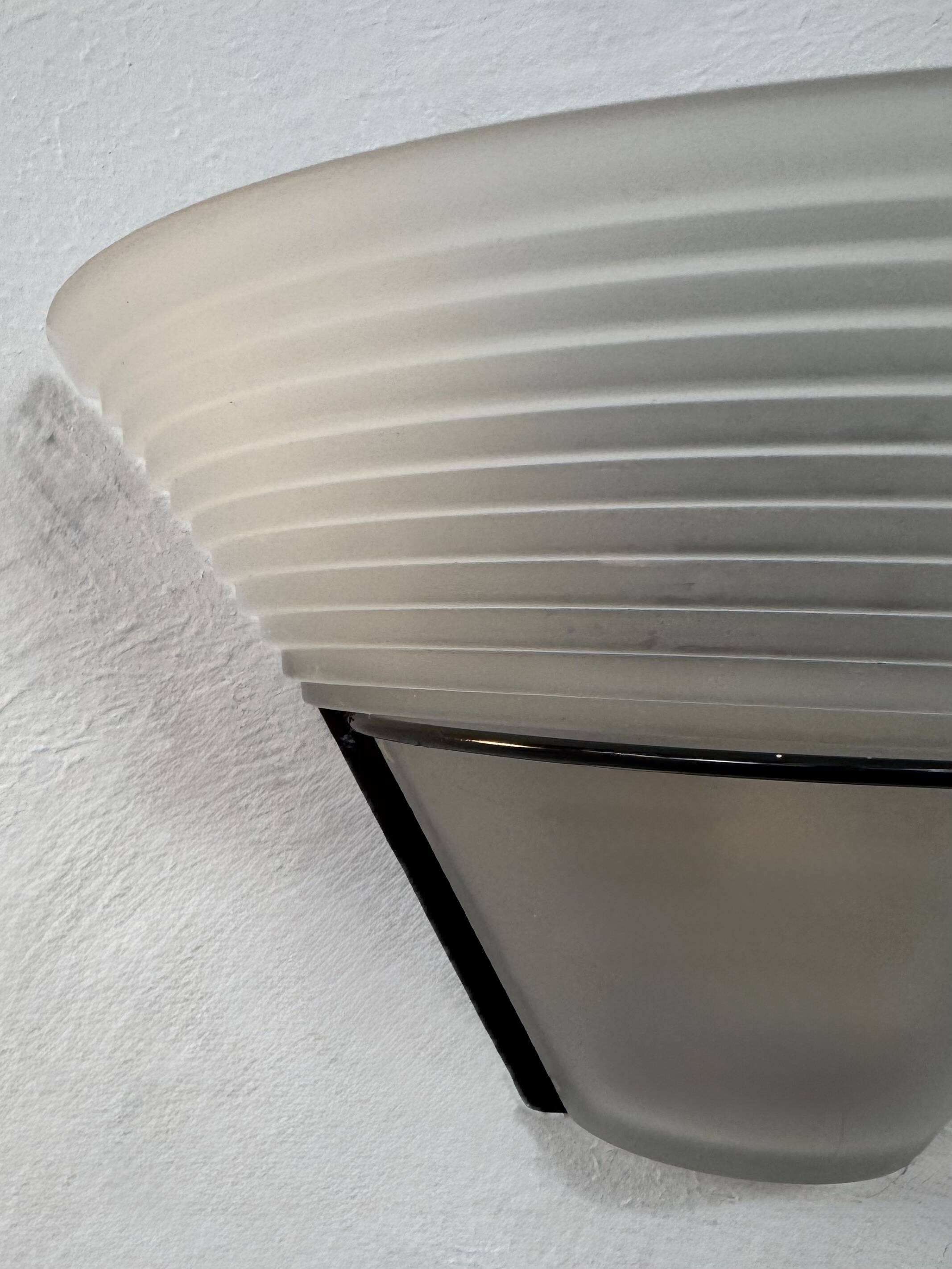 Frosted glass and black metal wall light, Italy, 1980.