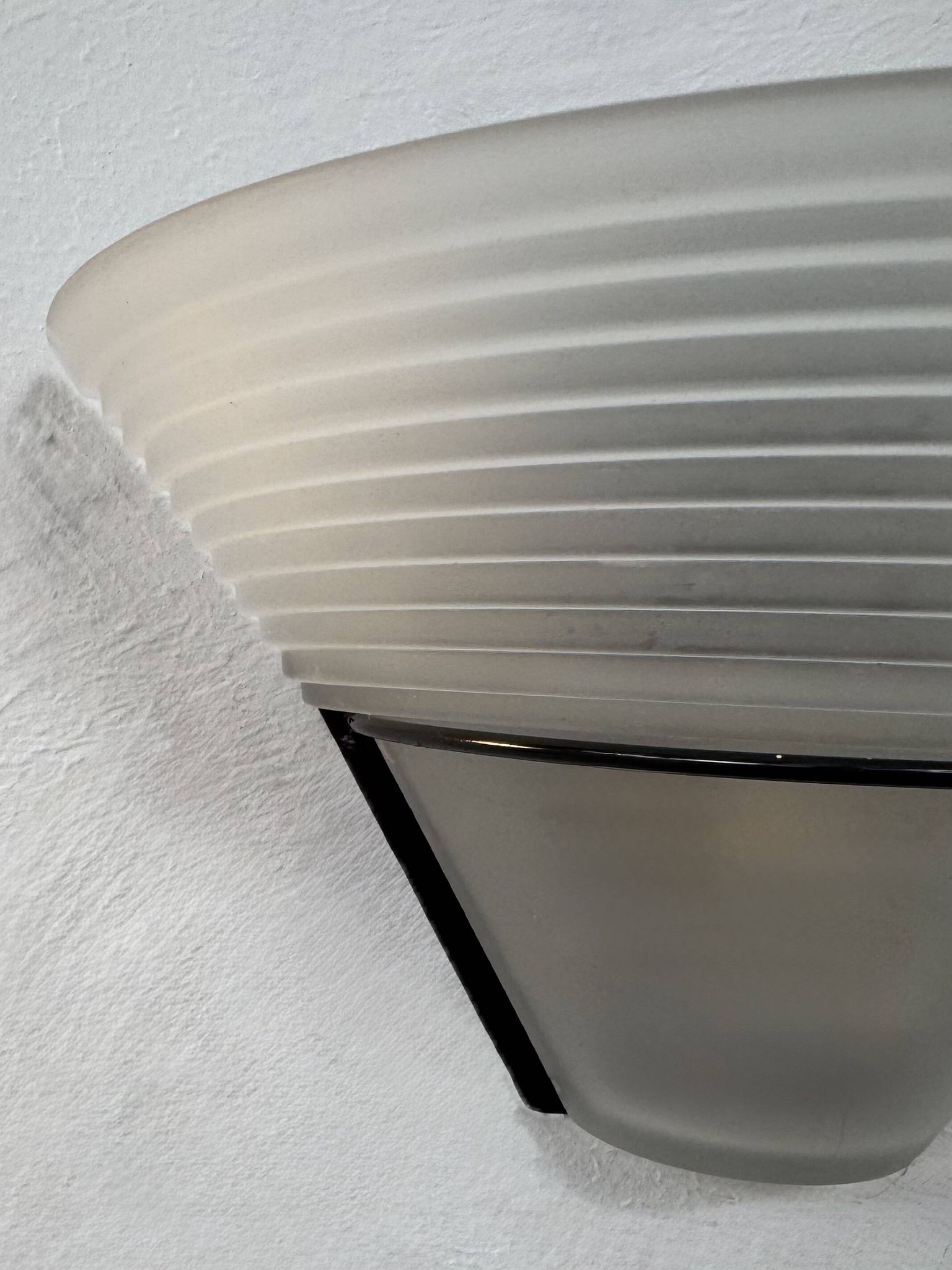 Frosted glass and black metal wall light, Italy, 1980.