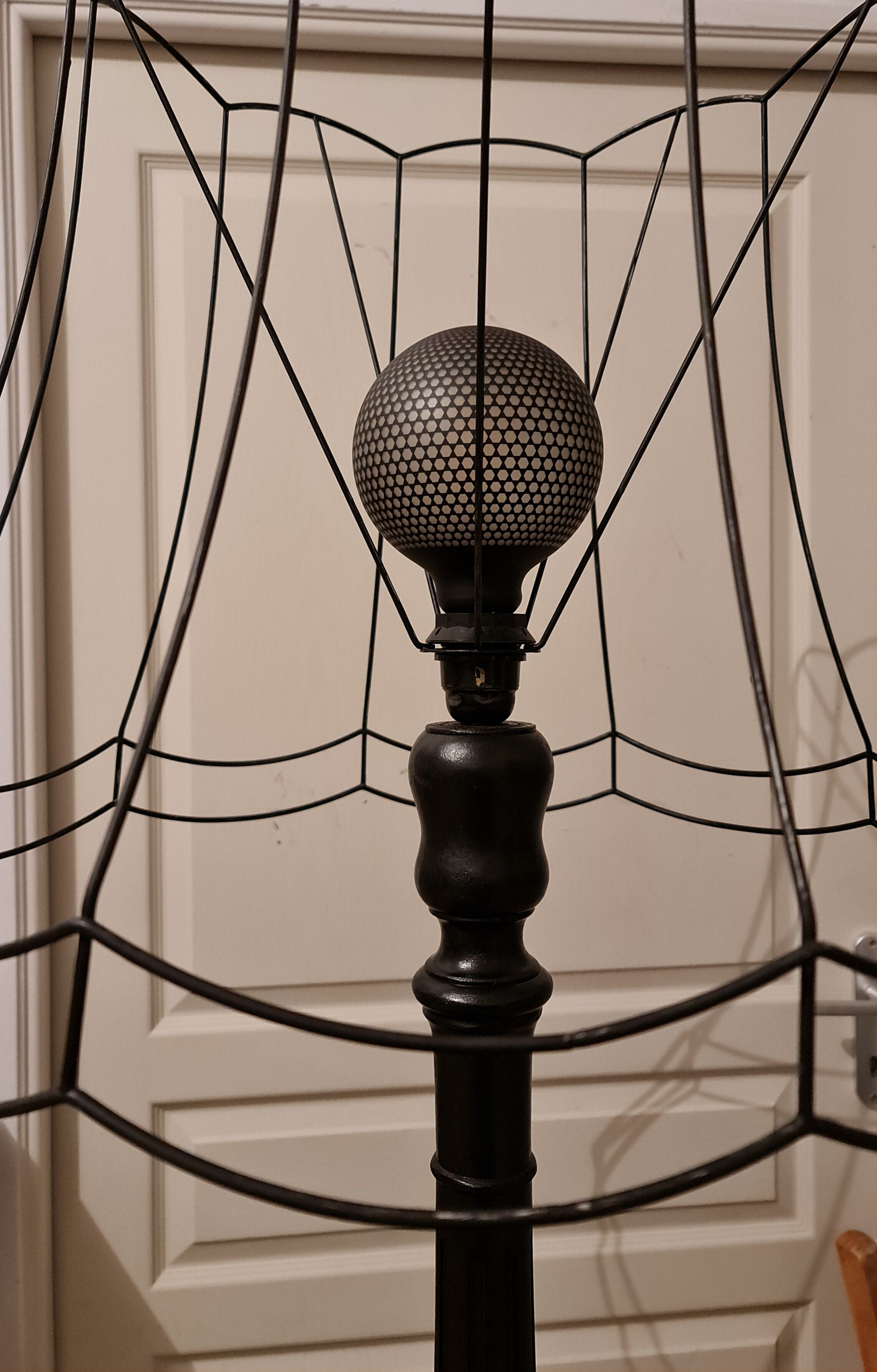 Matte black lamppost with small tablet