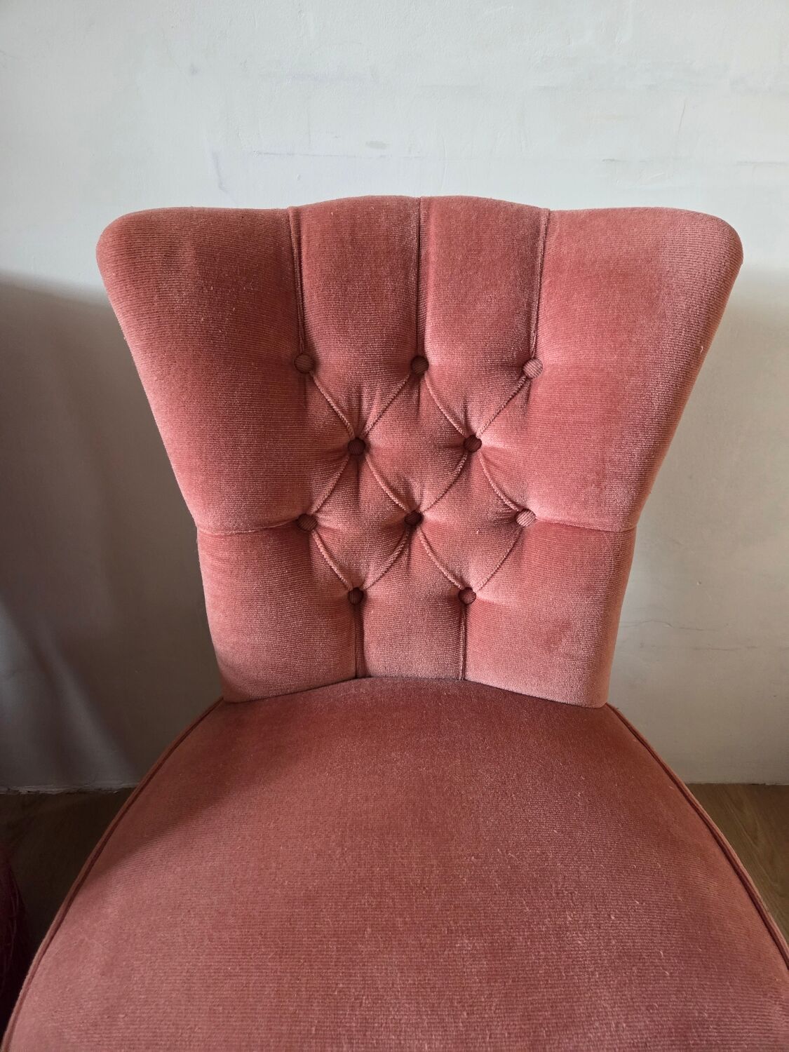A pair of small tub chairs.